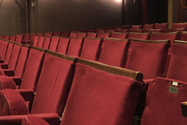 Rows of red seats inside the main theatre