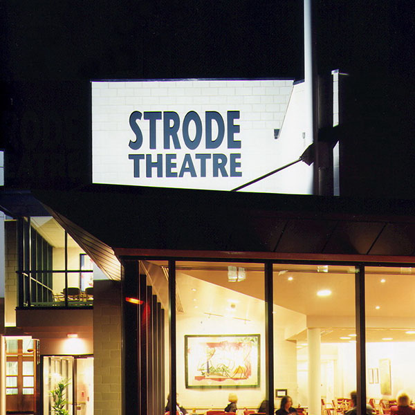 Exterior of Strode Theatre lit up at night